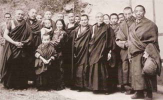 H.E. Dzogchen Rinpoche held by Mayumla, Pema Tsering Wangpo, his mother, with lamas, khenpos and senior monks